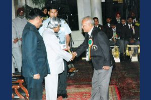 Receiving Award from President
