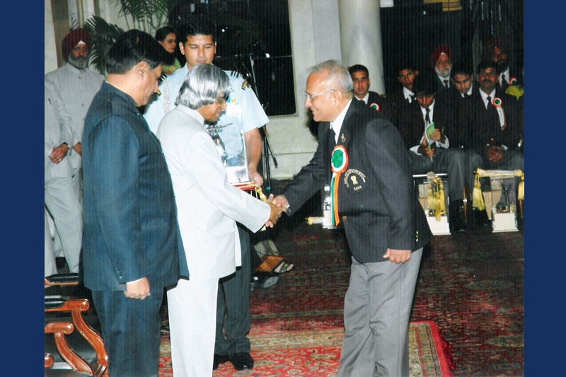 Receiving Award from President
